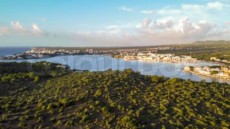 aerial drone view of the mediterranean coast at sunrise in porto colom, Majorca, balearic islands
