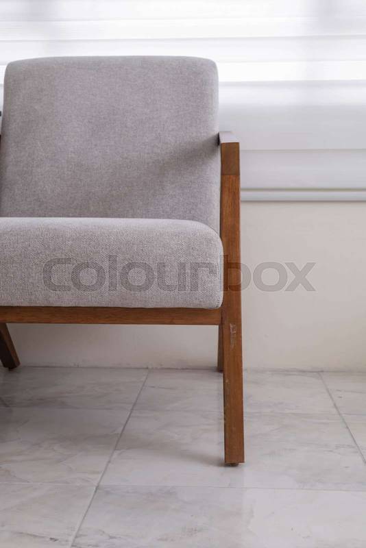 wooden chair with white fabric upholstery, showcasing a refined and timeless design