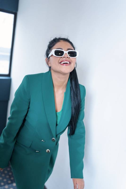 smiling latin young woman wear sunglasses