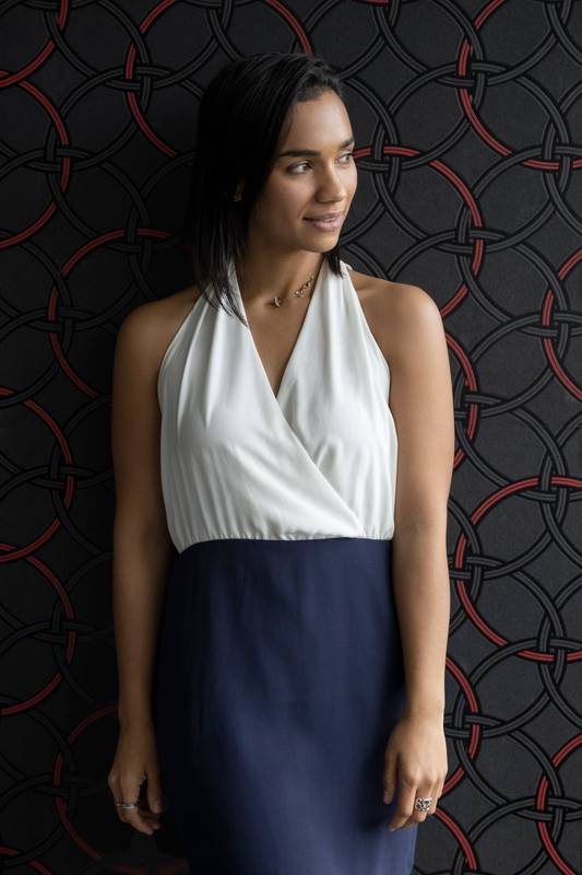 wearing an elegant dress in studio latin woman