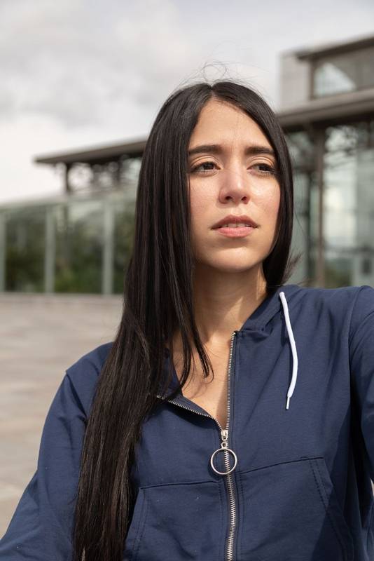 sunny day with a beautiful young latin woman with long, straight and black hair