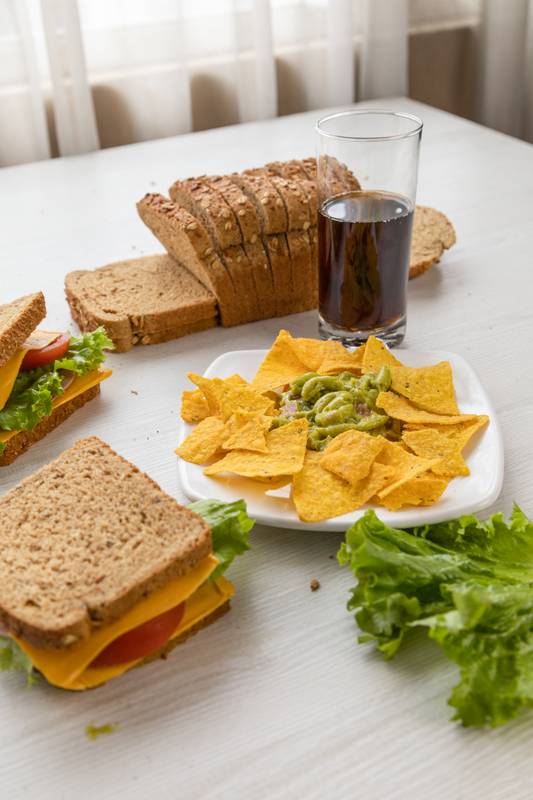 plate with nachos and guacamole on a table, delicious, snack