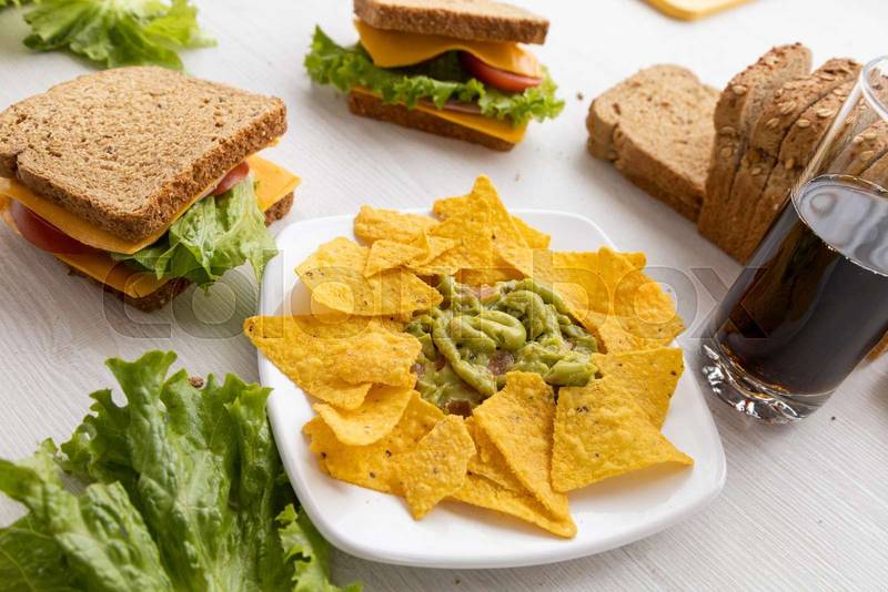 sliced bread and a plate with nachos, apetizzer snacks