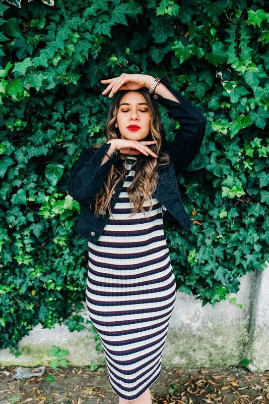 gesturing and posing with her hands a beautiful latin young female model