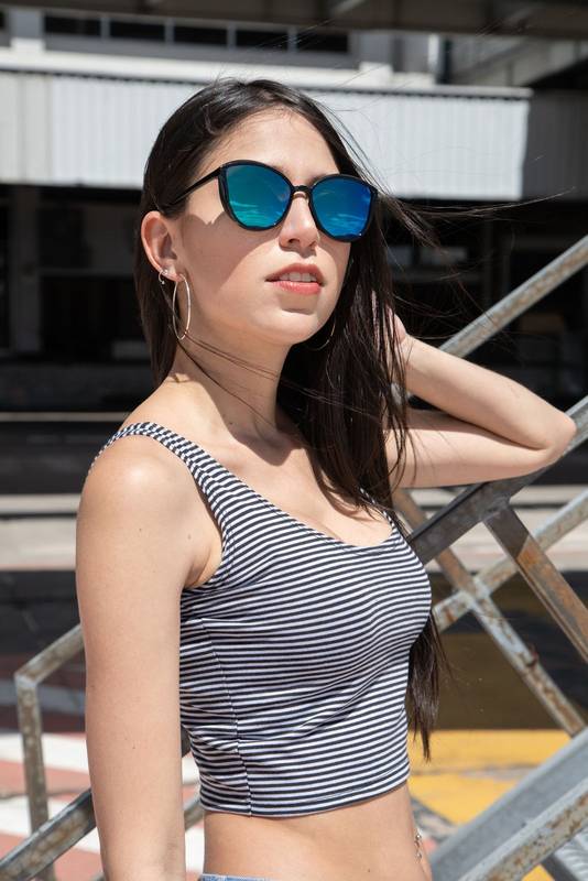 outside with sunny summer day a beautiful young woman