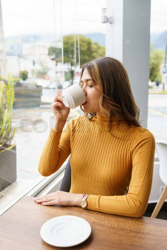 enjoying a cup of coffee in the morning, beautiful woman, latin