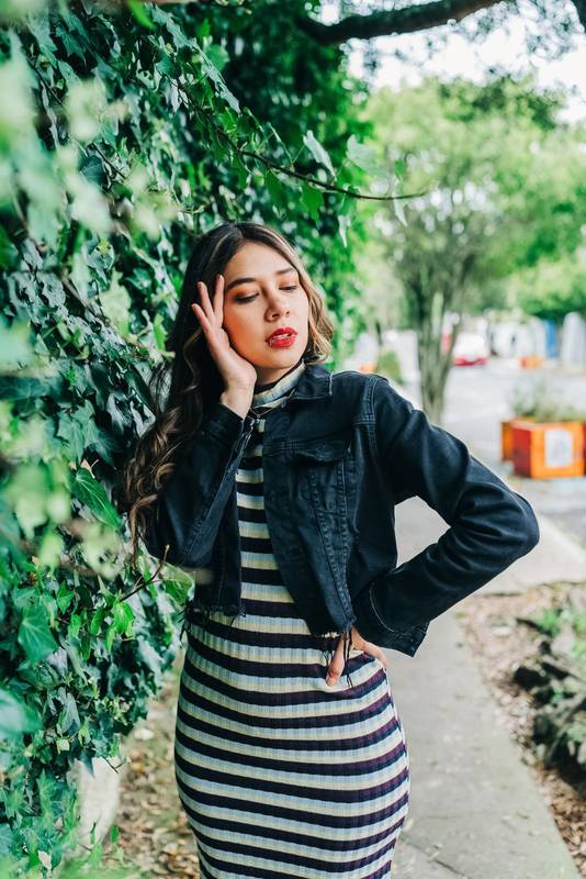 lifestyle model young latin woman with long blonde hair, wear trendy makeup