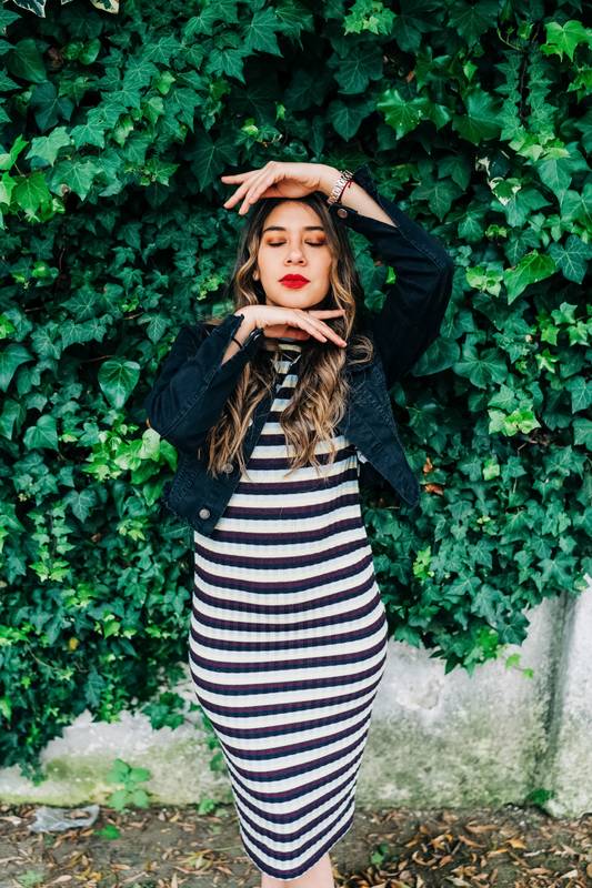 gesturing and posing with her hands a beautiful latin young female model