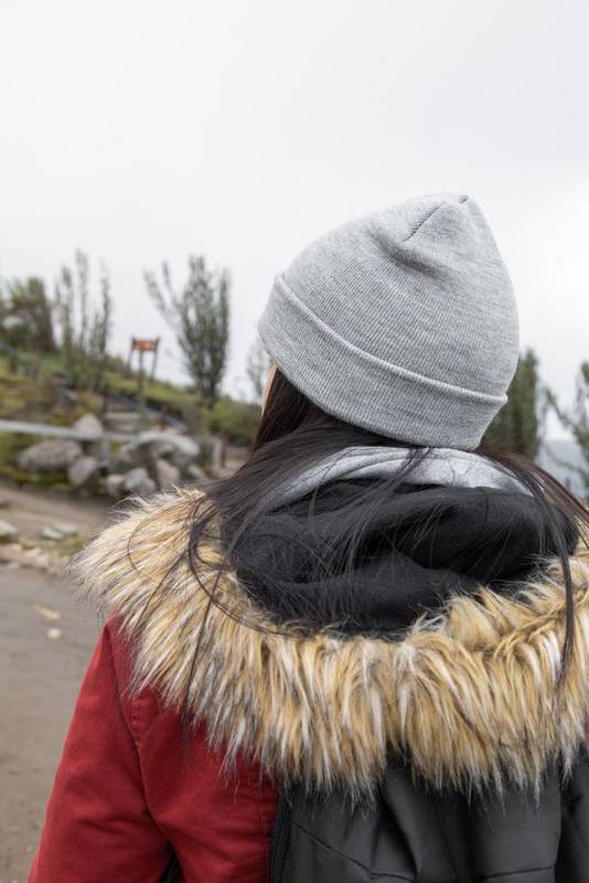 taking a walk a person wearing a wool cap as an accessory, tourist lifestyle