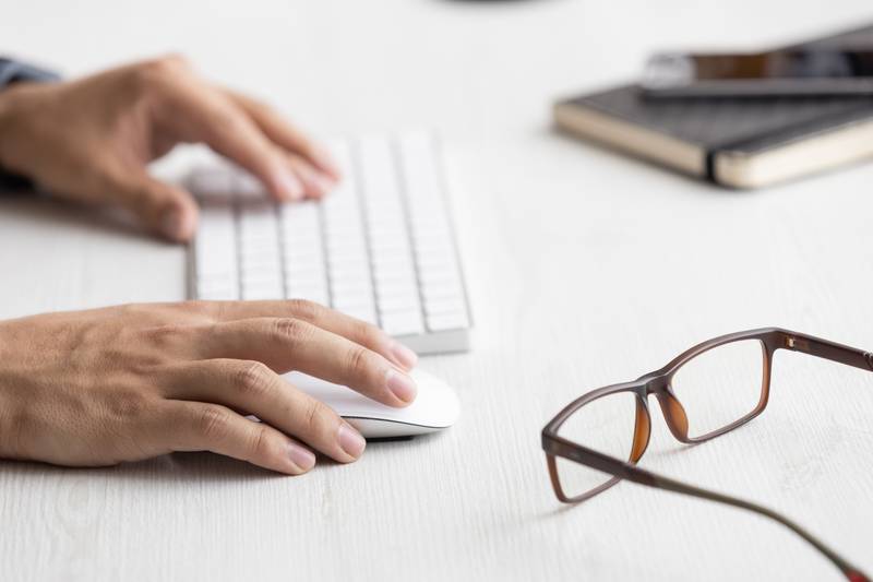 typing on a modern keyboard, technology and modernity at work desk