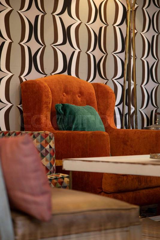 colorful decor of a living room with a beautiful modern orange sofa