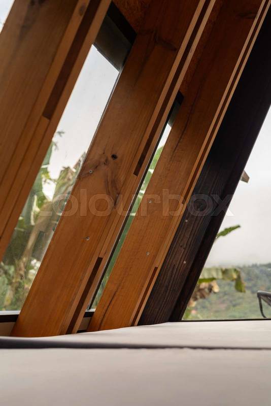 wooden beams stand as columns in a refined rustic cabin design