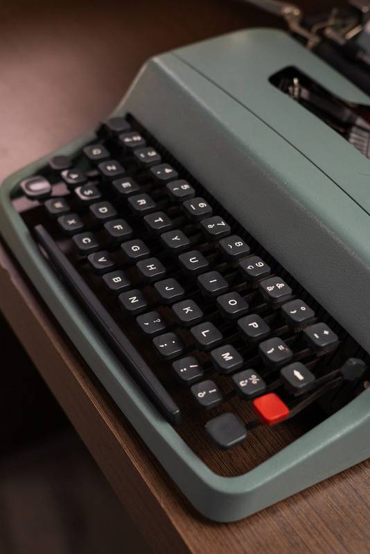 vintage typewriter showcasing its classic keys and metal parts. This nostalgic image