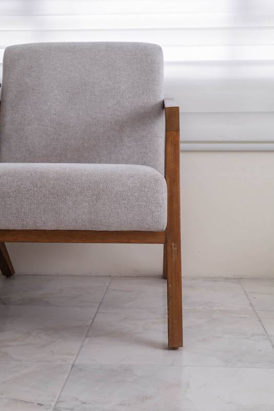 wooden chair with white fabric upholstery, showcasing a refined and timeless design