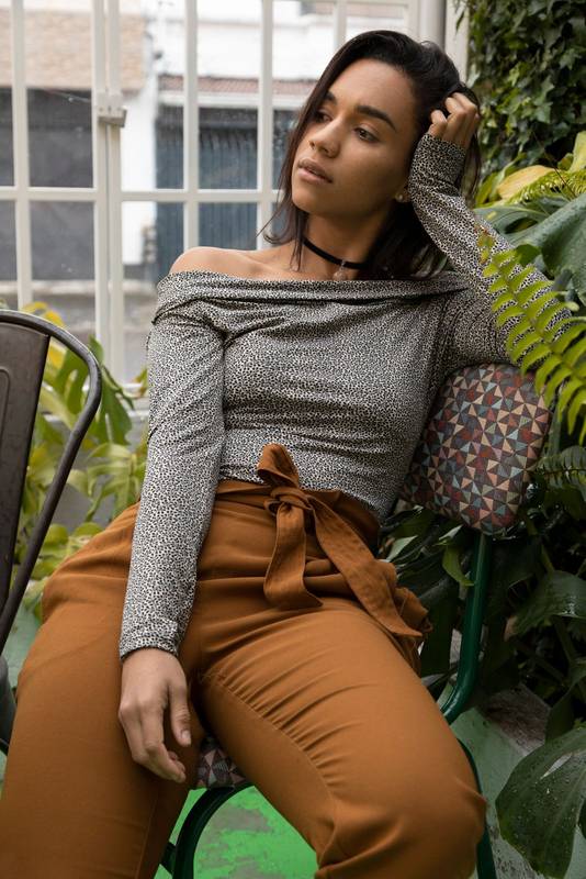 relaxed, posing sitting on a chair, wearing casual clothes
