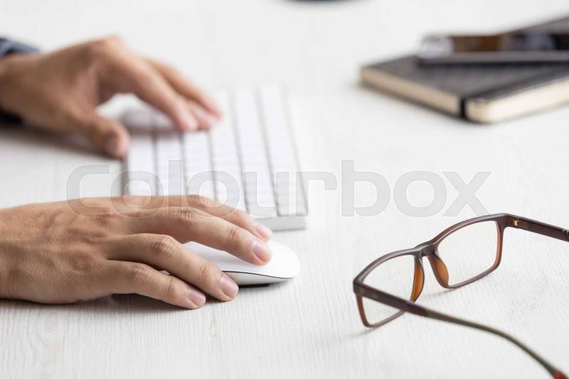 typing on a modern keyboard, technology and modernity at work desk