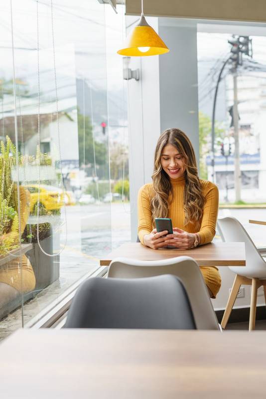 using her cell phone to send messages while waiting, lifestyle and interior decoration, technology