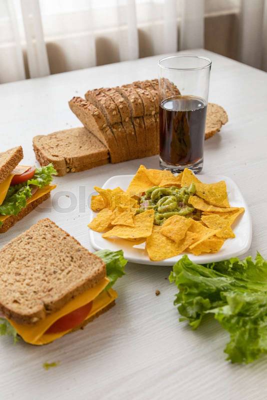 plate with nachos and guacamole on a table, delicious, snack