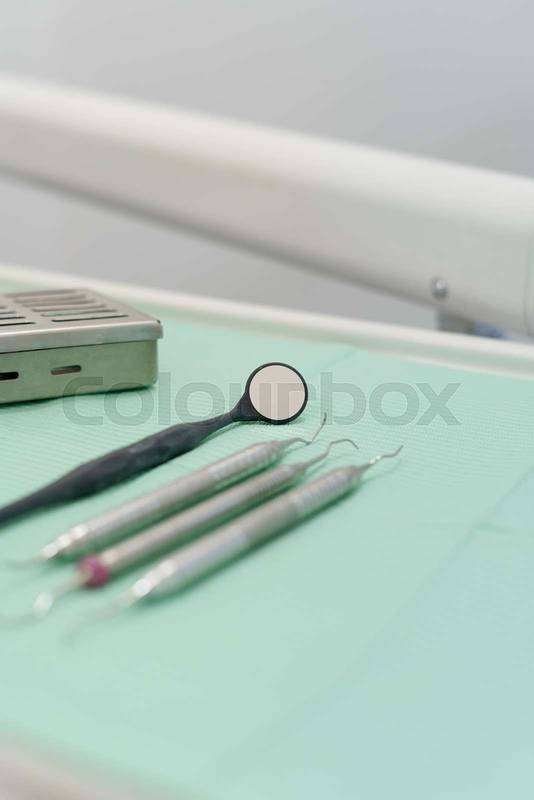 professional dental instruments, arranged on the work table in an orderly manner