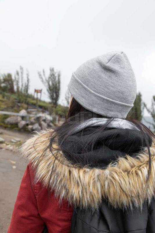 taking a walk a person wearing a wool cap as an accessory, tourist lifestyle