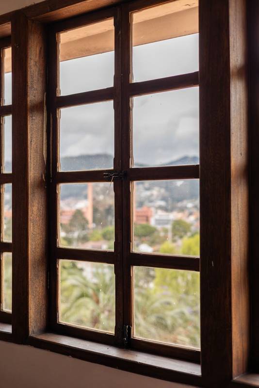 wooden grid window with small square glass panes
