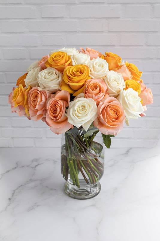 colorful bouquet of beautiful roses in a glass vase, beauty of nature, decorative element